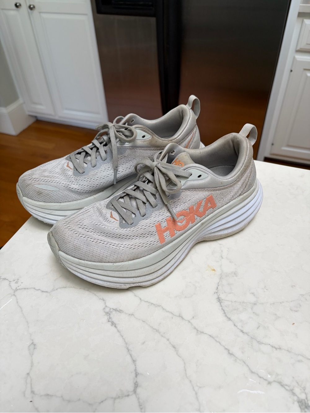 Hoka Women's bondi 8 in Light Gray with Coral Logo